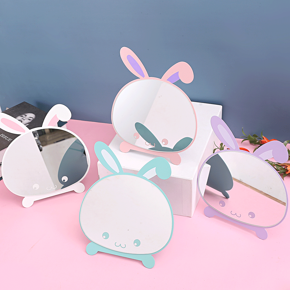 Cartoon - style simple folding table - top makeup mirrors. Cute and creative portable dressing mirrors with rabbit - shaped designs for desktop use