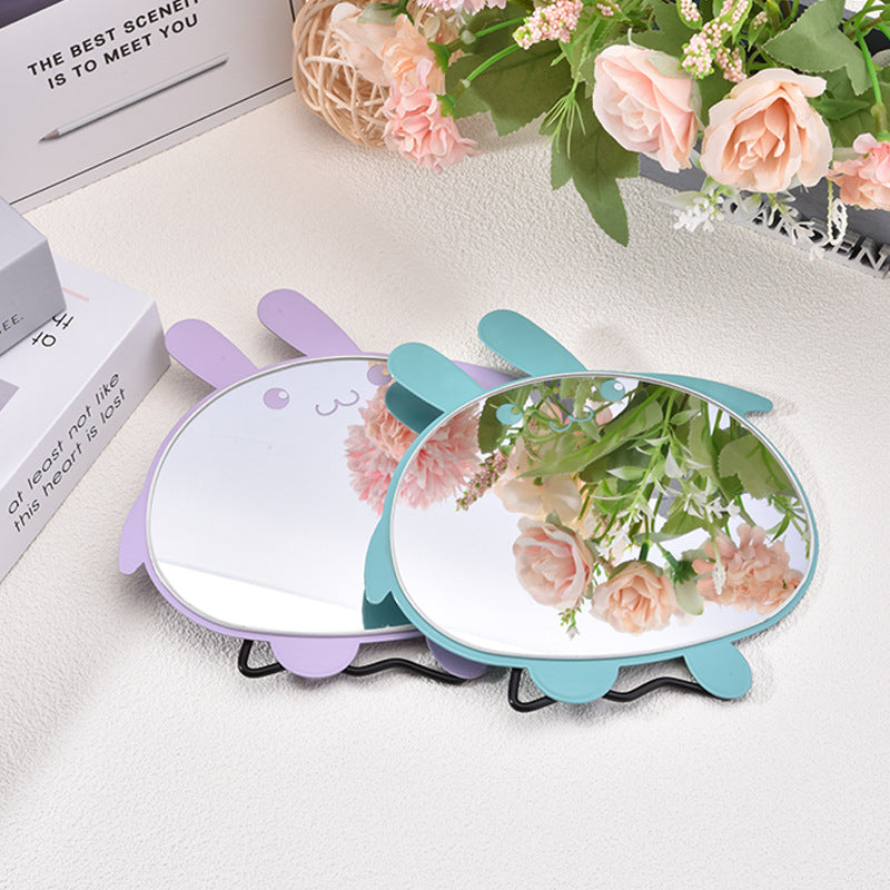 Cartoon - style simple folding table - top makeup mirrors. Cute and creative portable dressing mirrors with rabbit - shaped designs for desktop use